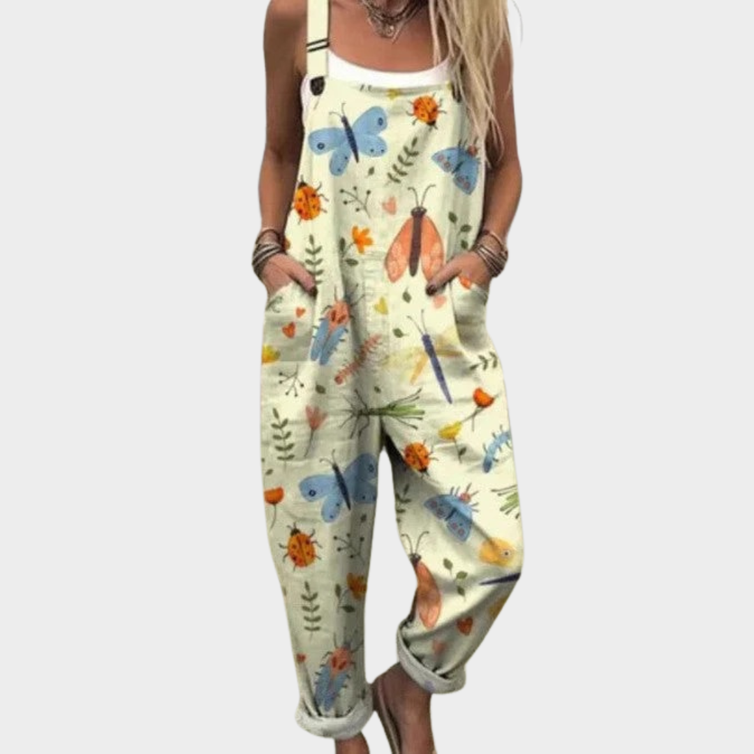 Light green loose overalls with colorful animal/insect print, front bib and pockets
