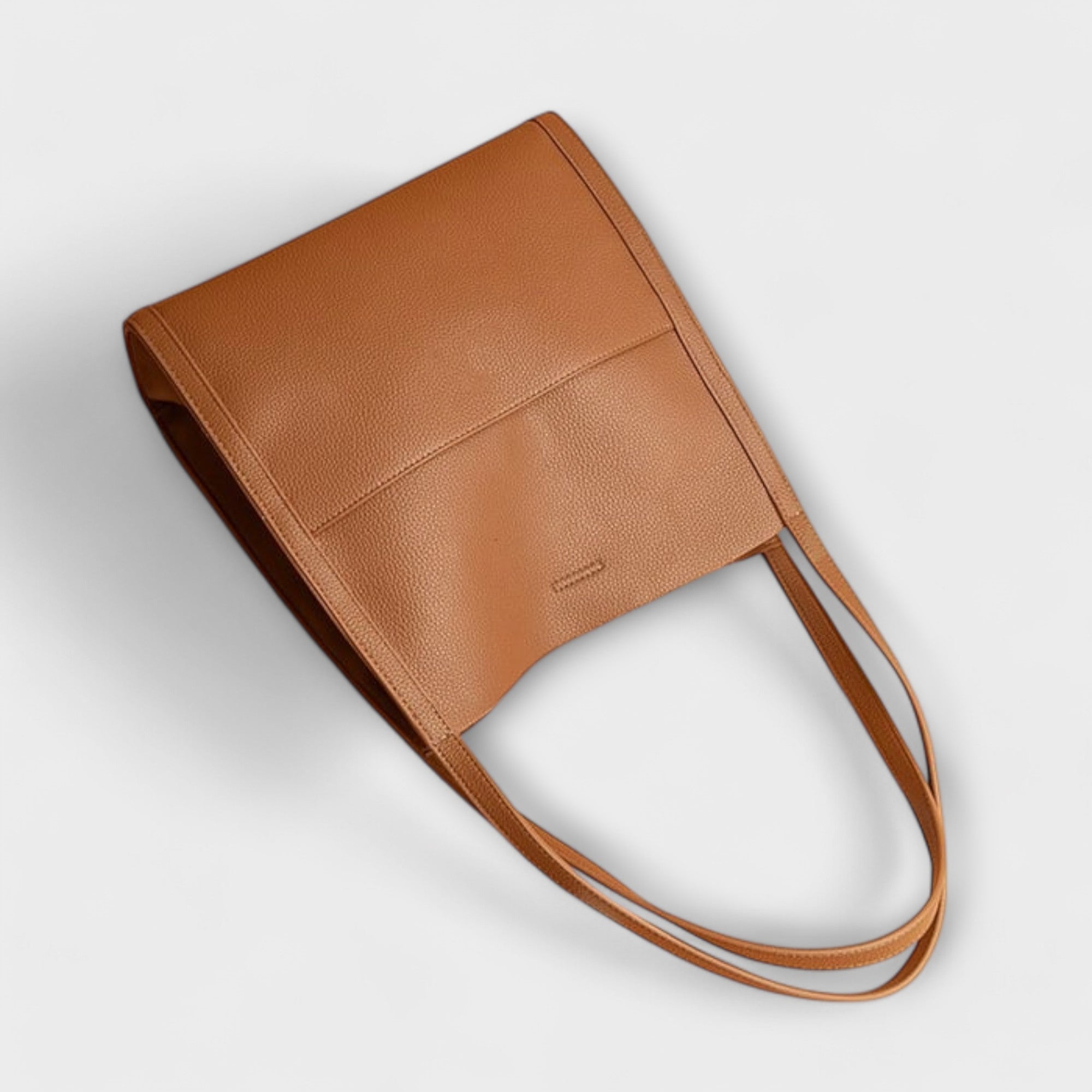 Tan/brown natural leather wristlet with flap closure and side strap handles