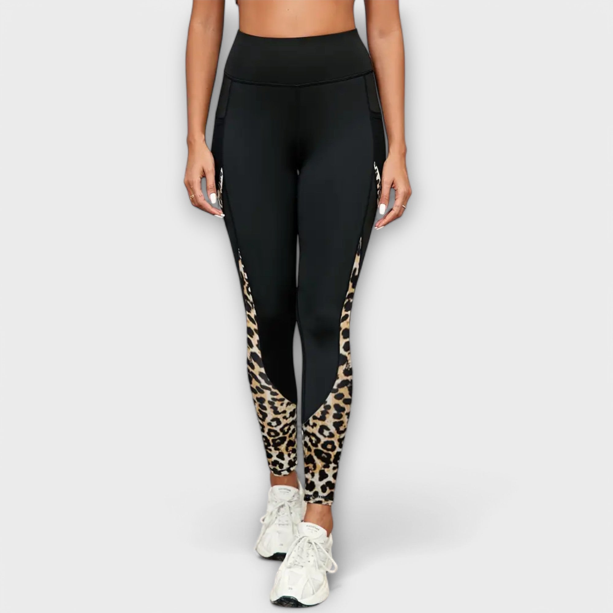High-waist black leggings with leopard-print inserts at the hips and calves