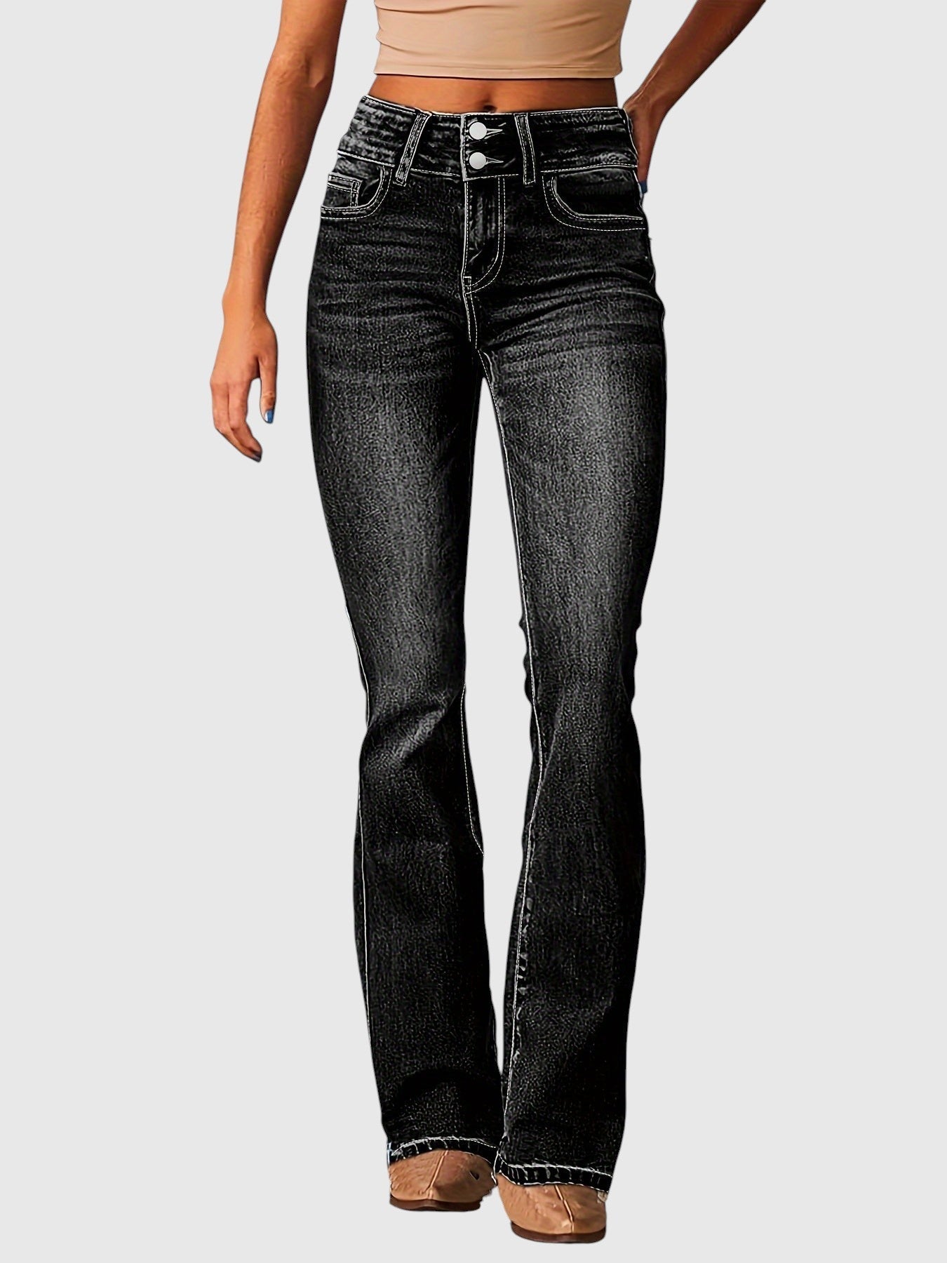 High-waisted slim-fit black jeans with button fly, belt loops, five pockets