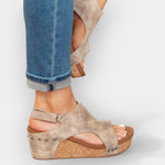 Beige suede platform wedge sandals with studded strap detail and open toe
