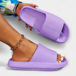 Lavender slide sandals with wide knit-look strap and open toe