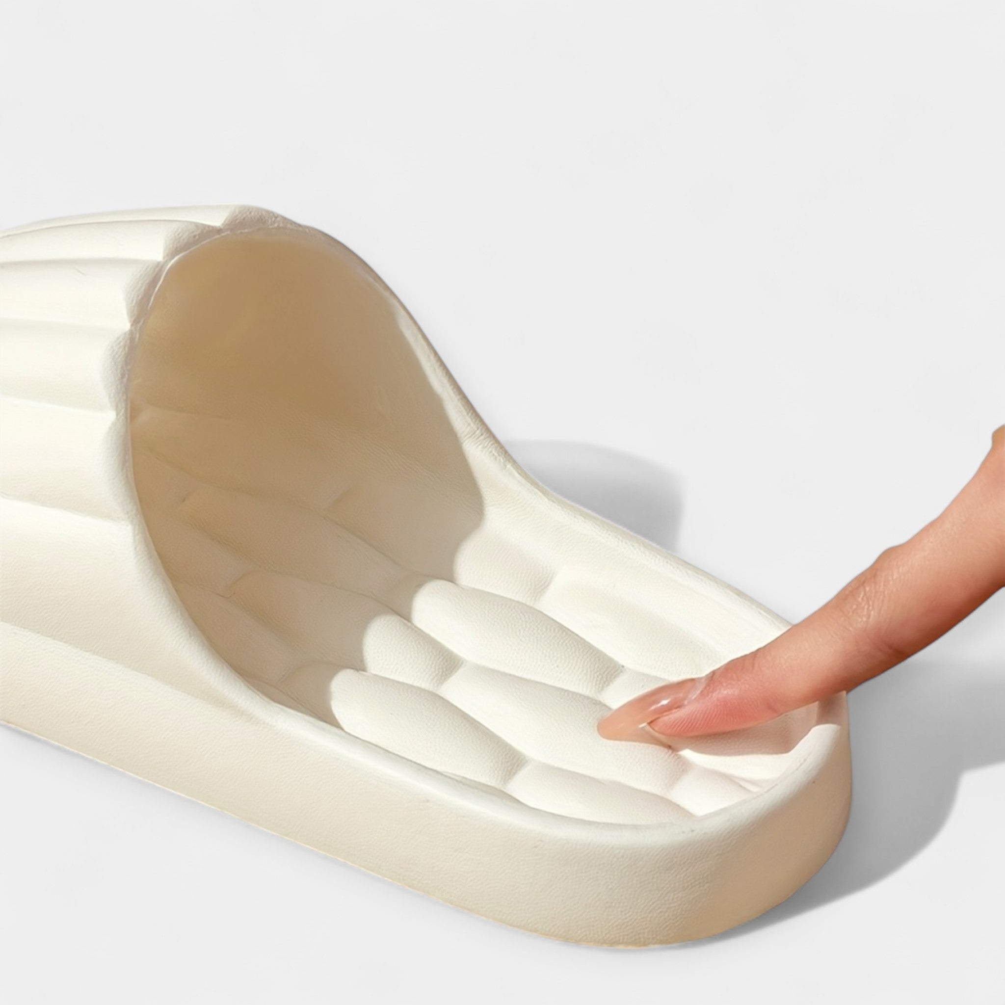 All-season slippers, cream molded insole with molded channels and open-toe slide design