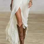 White long linen dress detail: wrap front slit, button placket and waist belt.