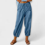 Light blue harem pants with elastic waist and side cargo pockets