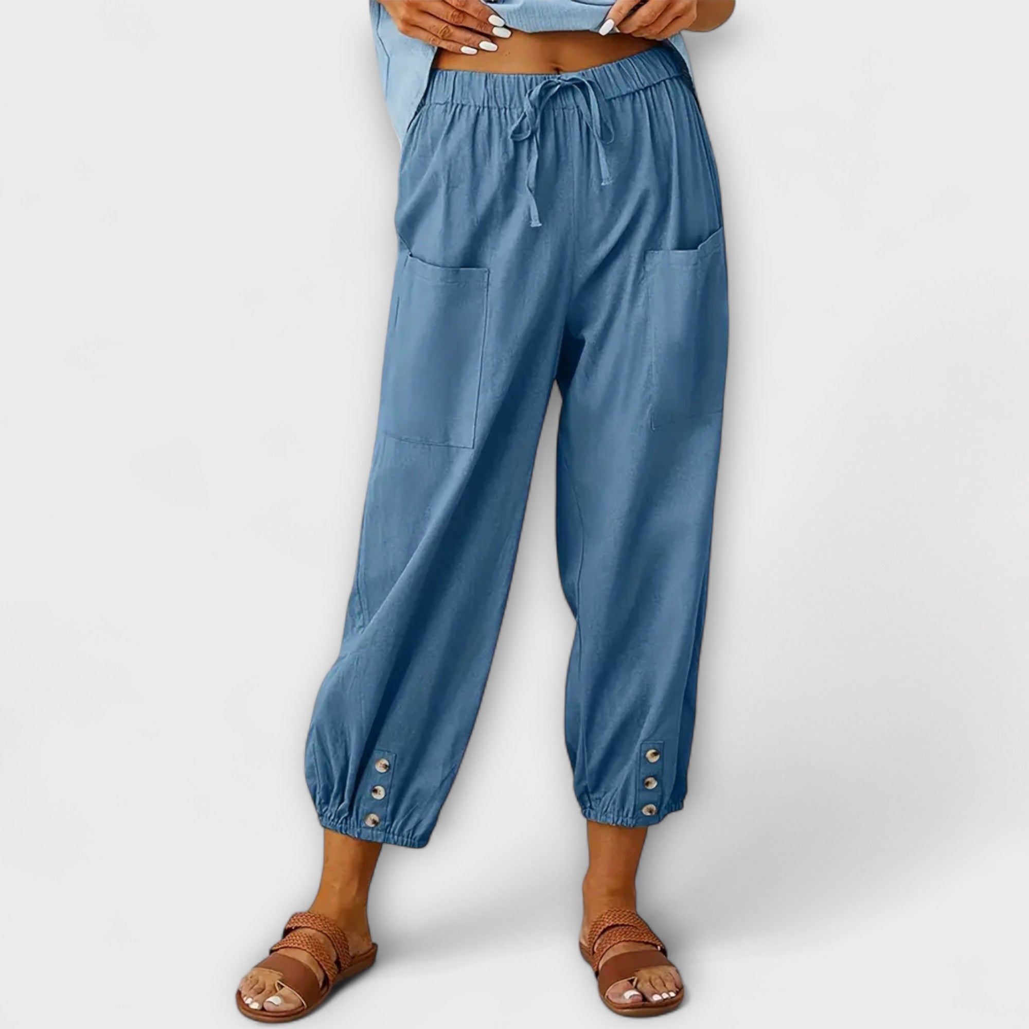 Light blue harem pants with elastic waist and side cargo pockets