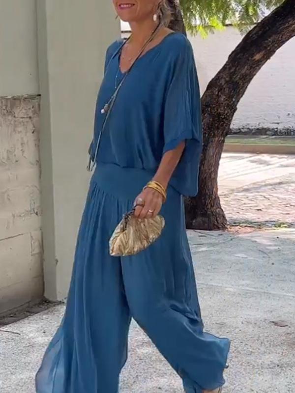 Two-piece chiffon set with V-neck blouse and wide-leg pants, medium blue.