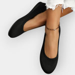 Black knit slip-on ballet flats with rounded toe and flat sole
