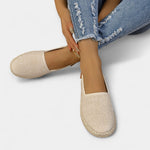 Beige fabric slip-on loafers with jute-style braided edges and round toe