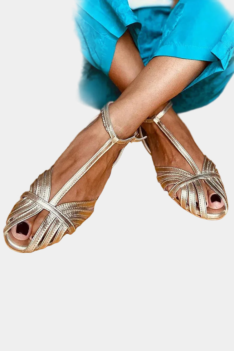 Gold strappy sandals with crossover straps and open toe, ankle buckle closure