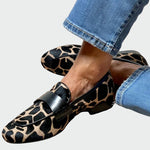 Leopard-print loafers with black strap detail