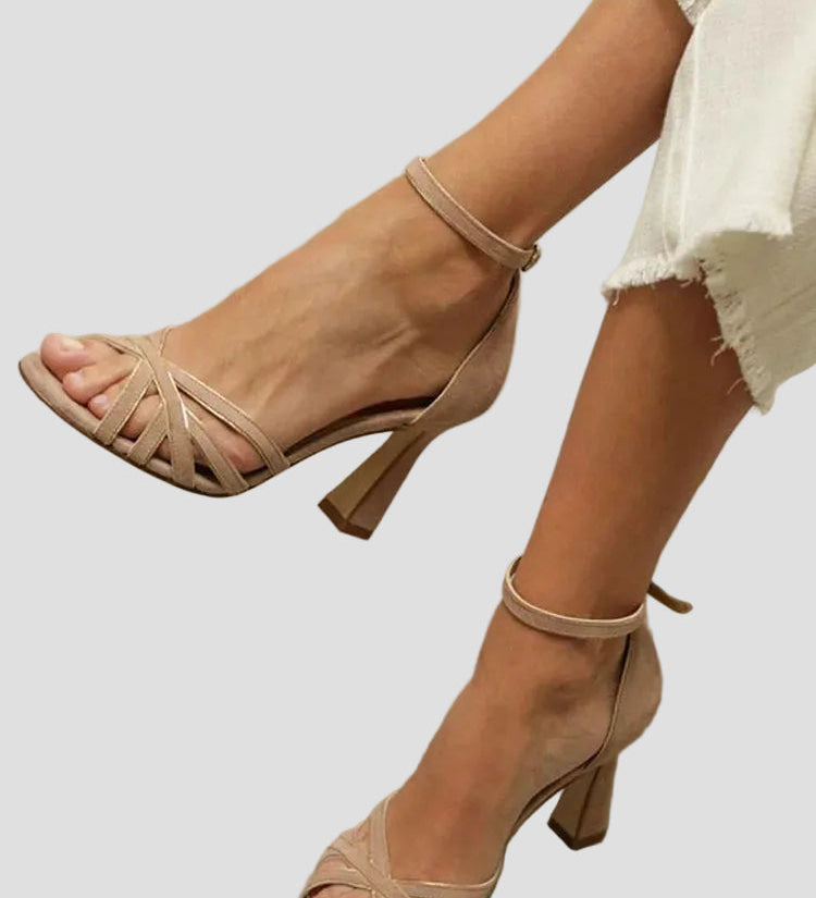 Light brown high-heel sandal with thin heel and ankle strap, open toe