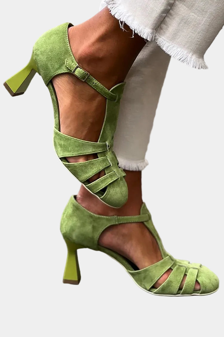 Green heeled sandals with ankle strap, open toe, and multiple crisscross straps