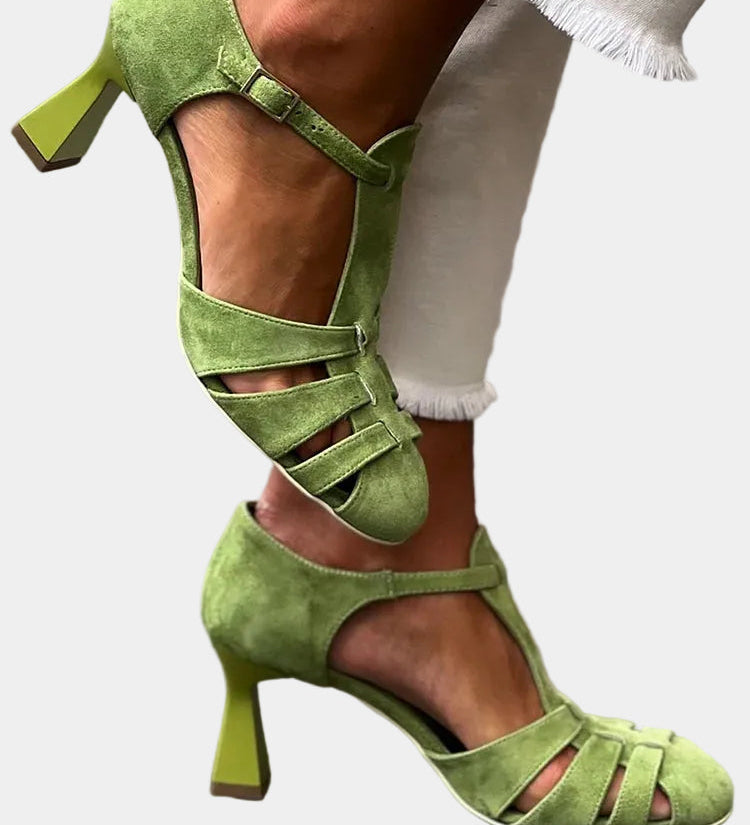 Green heeled sandals with ankle strap, open toe, and multiple crisscross straps