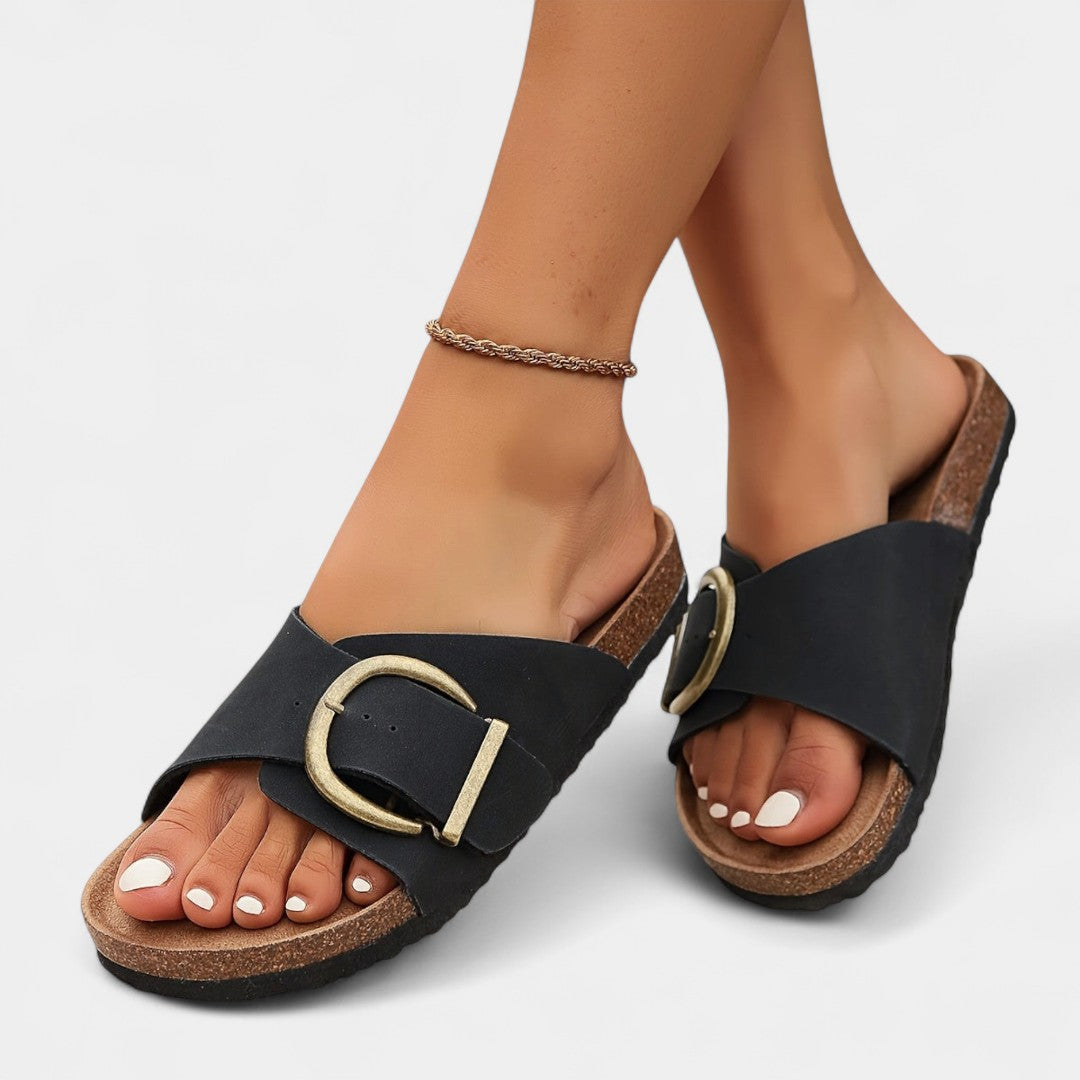 Lukia black cork slide sandals with gold-tone buckles and ankle chain strap