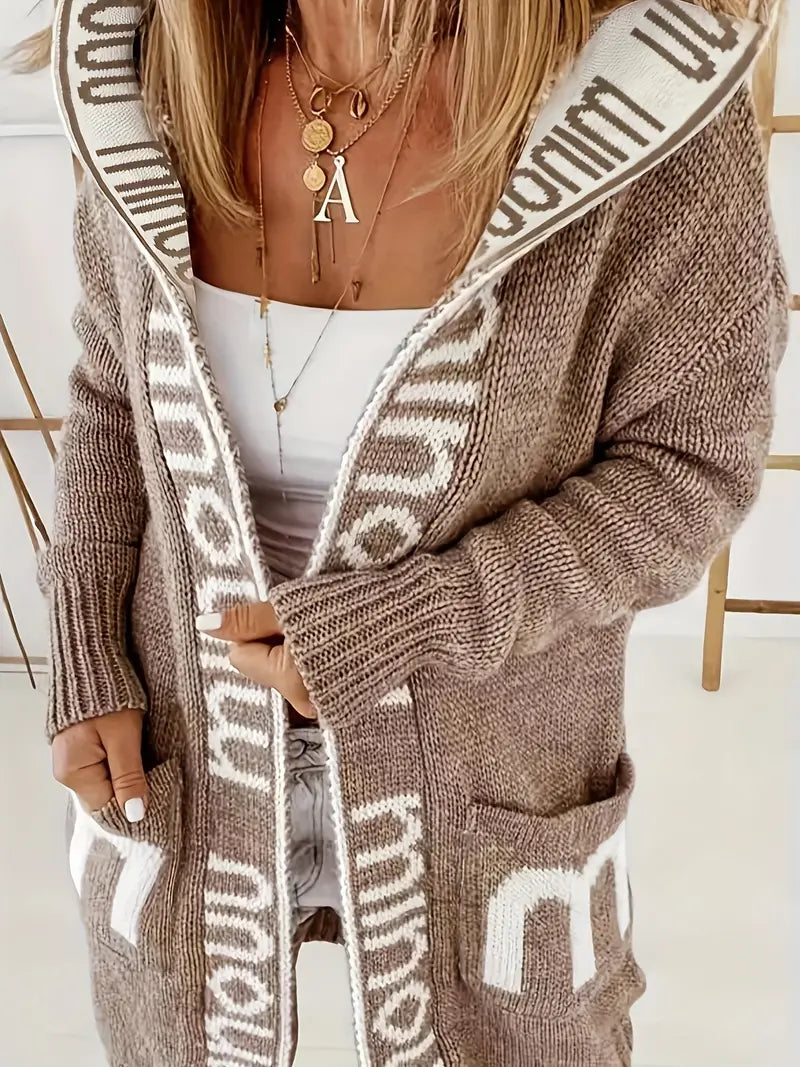 Light gray knit cardigan with white geometric trim and open front, long sleeves, pockets