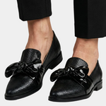 Black textured loafer shoes with glossy bow detail, low block heel
