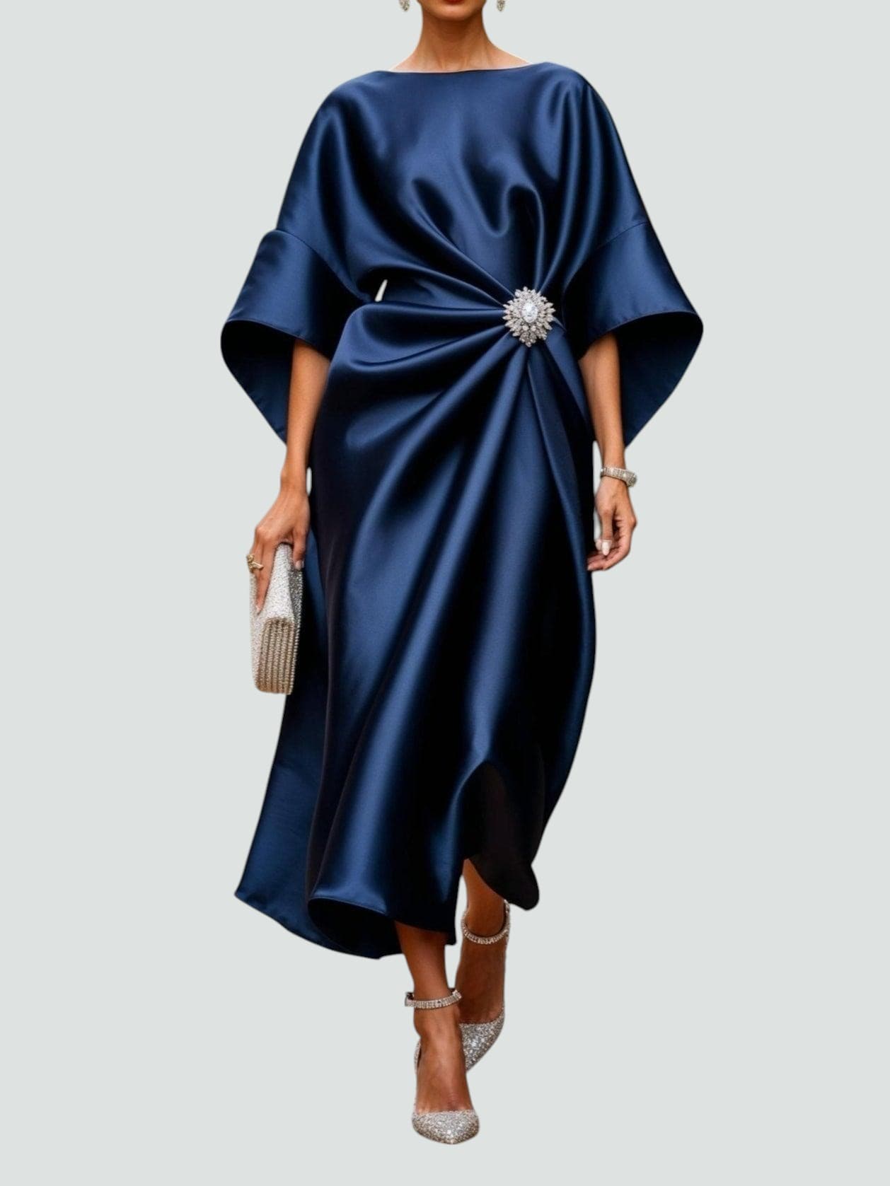 Navy satin long evening dress with draped batwing sleeves and jeweled center brooch.