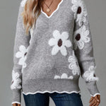 Gray floral V-neck sweater with white and dark-centered flower designs