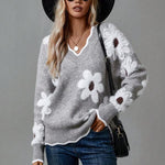 Gray floral V-neck sweater with white and dark-centered flowers, long sleeves