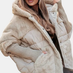 Beige hooded puffer jacket with faux-fur collar and quilted body, zip front visible