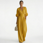 Mustard yellow v-neck belted jumpsuit with gathered waist and wide-leg pants
