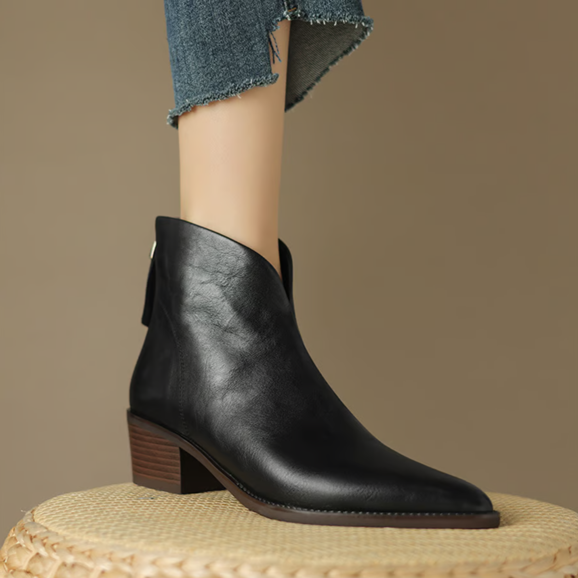 Black leather ankle boots with low block heel and side pull tabs