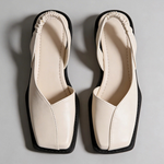 Pair of Emanuela square-toe moccasins in beige with black trim and outsole