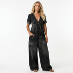 Black denim V-neck tie-front short-sleeve jumpsuit with button front, patch pockets, wide legs