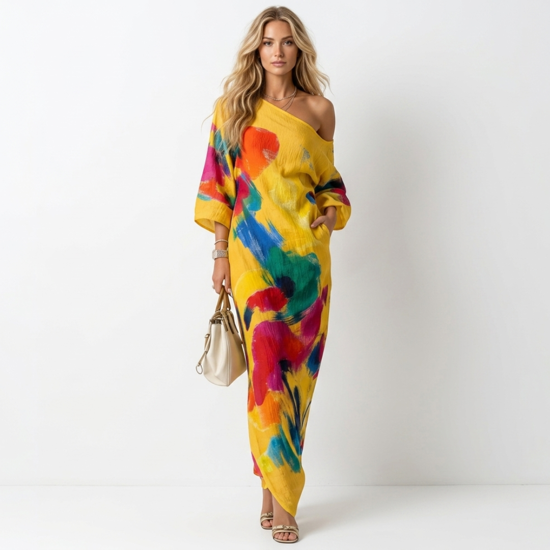 One-shoulder maxi dress, yellow base with colorful abstract paint print and long loose sleeves