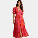 Pink and orange maxi dress with deep V-neck, puff sleeves, and front slit