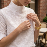 Women's white floral embroidered blouse with high neckline detail