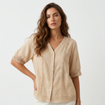 Light beige lightweight blouse, V-neck button front, embroidered vertical panels, short sleeves.