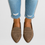 Taupe suede leather moccasin loafers with stitched vamp and moc-style seam.