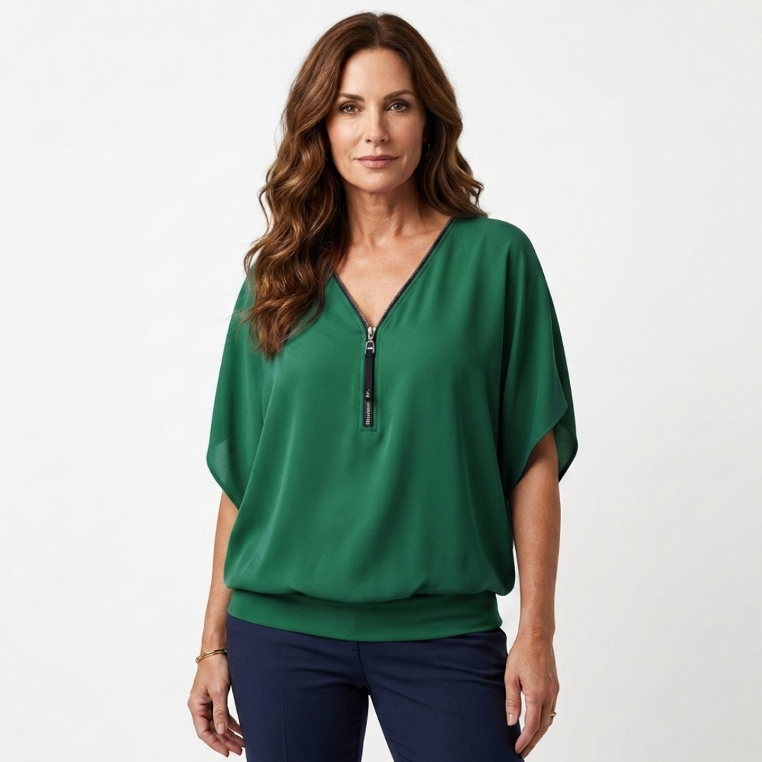 Green zip-front blouse with short dolman sleeves and V-neck placket