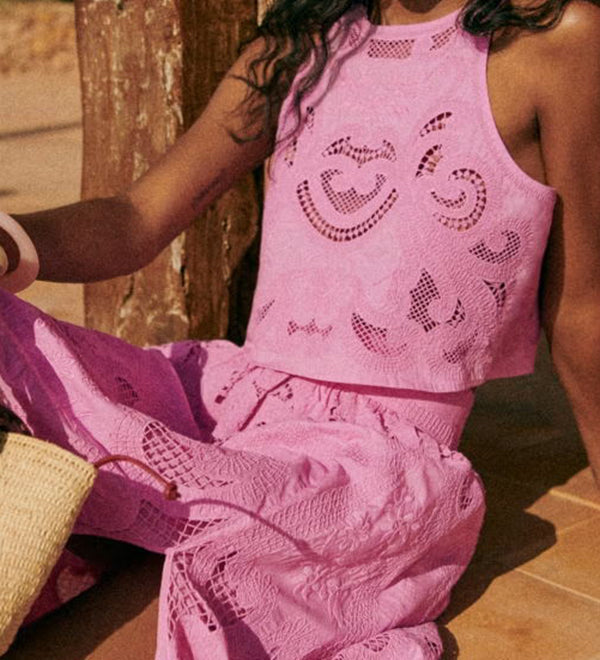 Pink lace sleeveless top and ruched midi skirt set, textured eyelet details