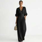Black v-neck belted jumpsuit with gathered waist and wide-leg pants