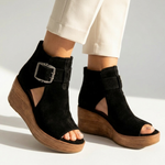 Black suede ankle-boot style wedge sandals with open toe and buckle strap