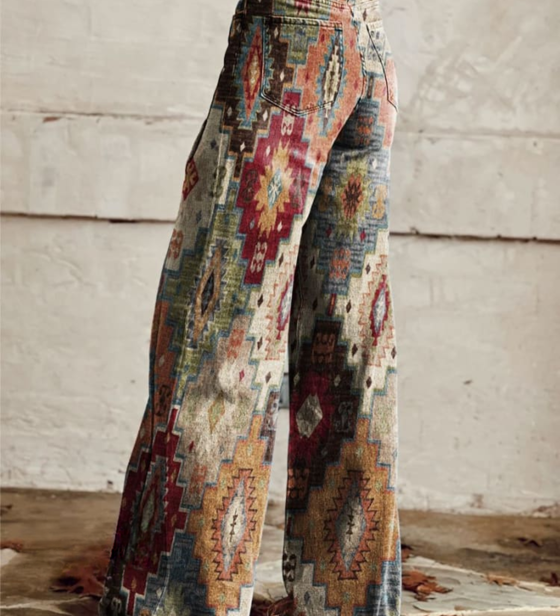 Boho wide-leg trousers in light denim with multicolor geometric tribal print, side view