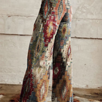 Boho wide-leg trousers in light denim with multicolor geometric tribal print, side view
