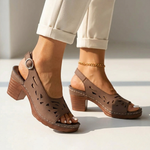 Brown orthopedic slide sandals with cutout leather uppers and chunky block heel