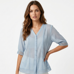 Light blue lightweight blouse, V-neck button front, stitched border detail, short sleeves.