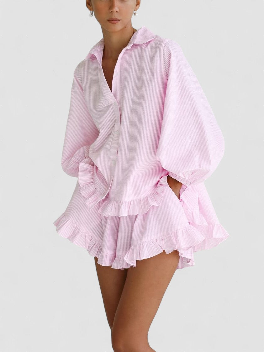 Pink short dress set with puff sleeves, button-up top, and layered ruffle skirt hem