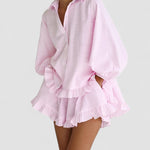 Pink short dress set with puff sleeves, button-up top, and layered ruffle skirt hem