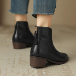 Black ankle boots with side zipper, low block heel, pointed toe