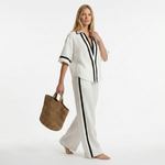 White graphic trim set with V-neck shirt and wide-leg pants, front detail