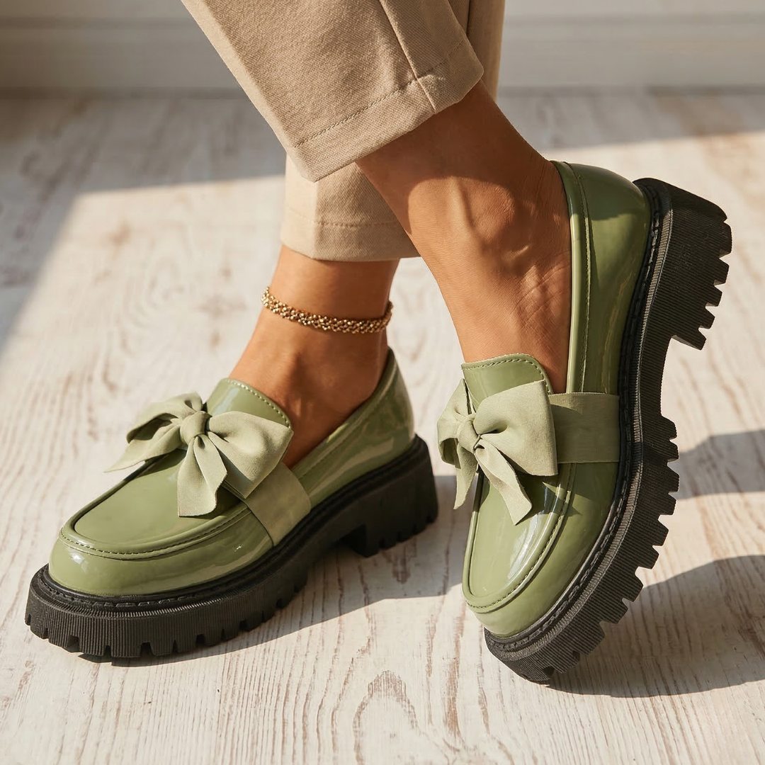 Water-resistant loafers in green with bow across vamp and thick rubber tread