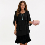 Black tiered ruffle dress with short cape sleeves and layered skirt, V-neck style