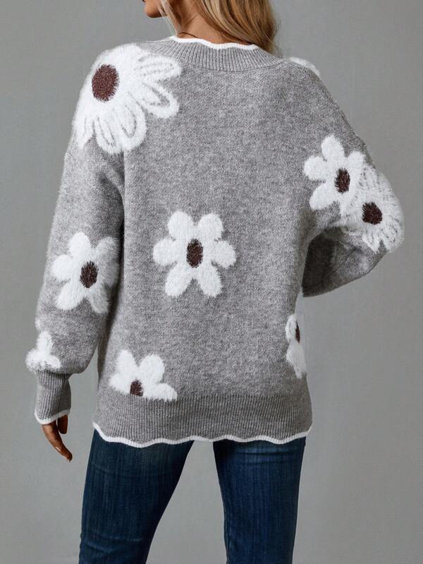 Gray knit sweater with large floral motifs on the back and ribbed hem