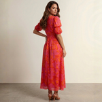Pink and orange maxi dress with deep V-neck, puff sleeves, and gathered waist